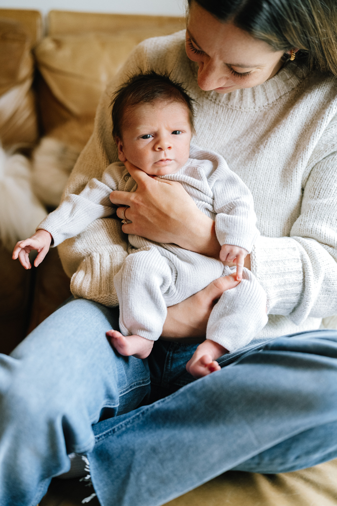 Mother cuddling baby close to her chest
