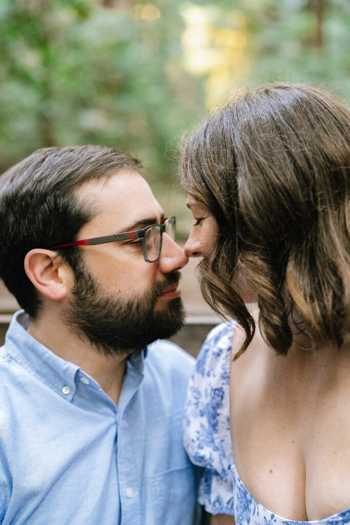 Intimate maternity portrait Santa Cruz redwoods — couple close together in soft forest light